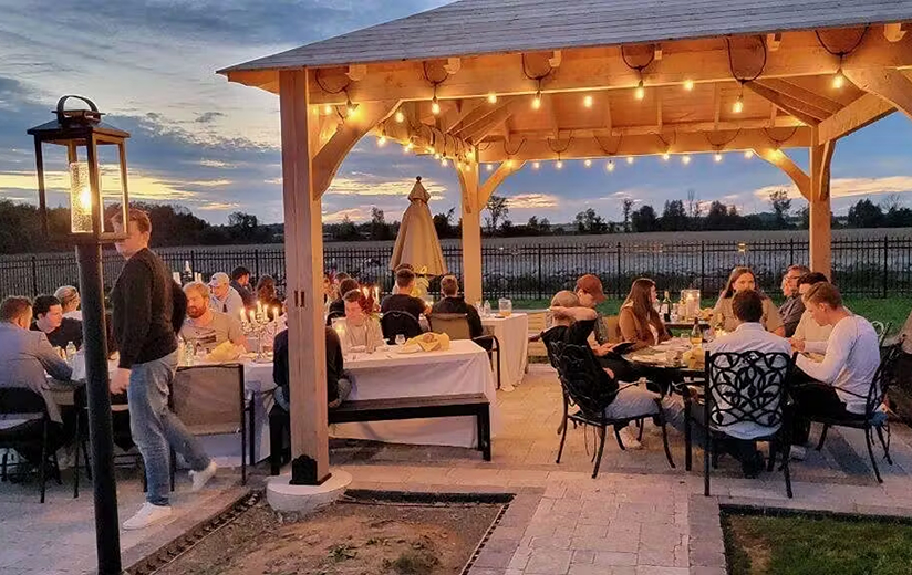Elegant interior dining room with coastal decor and natural light enhancing wood tones and serene ambiance.